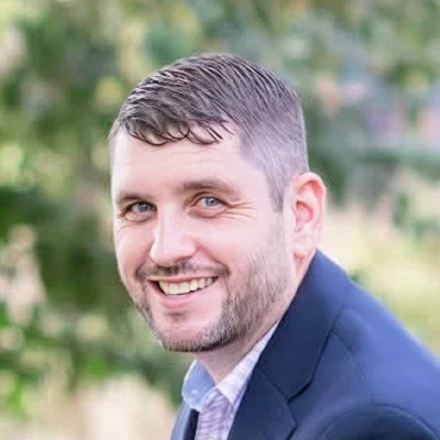 Optometrist Michael Huff Smiles at the Viewer